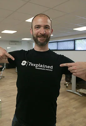 Trainer Olivier Thomas with a Texplained tee-shirt smiling